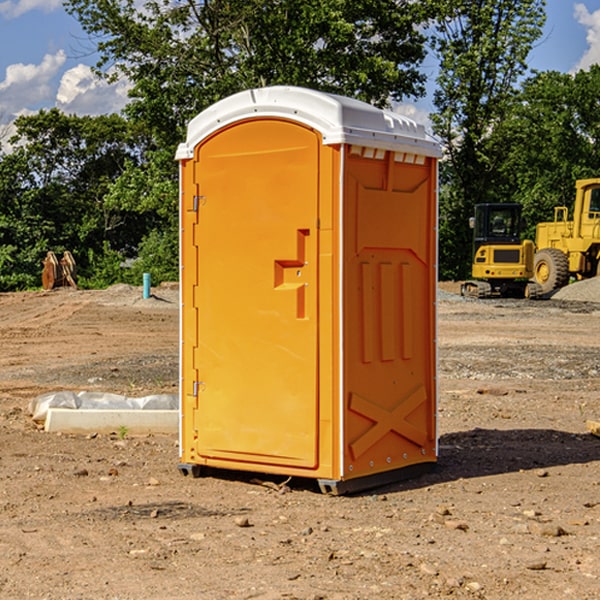 what is the cost difference between standard and deluxe portable restroom rentals in Jackson NE